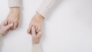 Close Up Of Senior Couple Holding Hands